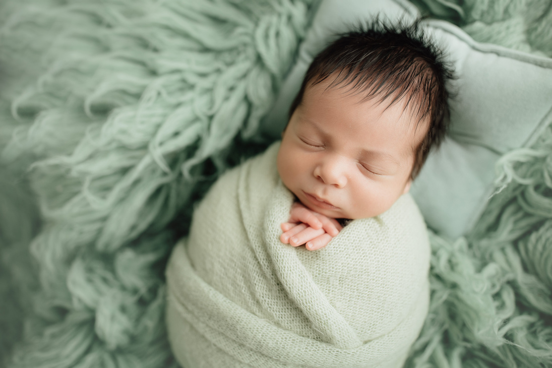 Newborn Wrapped in Blanket